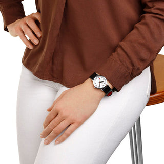 Classic, 30mm, stainless steel brushed Case Material and black vegan grape leather strap, A658.30323.16SBBV, Person mit Armbanduhr am Handgelenk