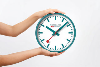 MONDAINE INTRODUCES THE LIMITED EDITION 25CM WALL CLOCK IN TRANSFORMATIVE TEAL