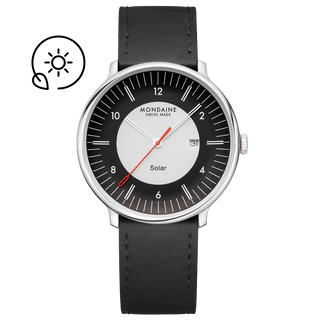 A black analog watch with a solar indicator on the dial and a black vegan grape leather strap. The watch has a silver case with a double domed sapphire crystal glass.