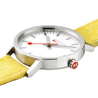 Classic, 30mm, modern yellow watch, A658.30323.17SBE, Detail close-up view with focus on the case and red crown